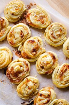 there are many small pastries on the baking sheet