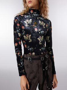 a woman wearing a black shirt with a floral print Fitted Long Sleeve Bodysuit With Floral Print, Fitted Bodysuit With Button Closure For Fall, Fitted Long Sleeve Bodysuit With Button Closure, Fitted Long Sleeve Bodysuit With Buttons, Closet Refresh, Floral Clothing, Clothing Details, Floral Outfit, Velvet Fashion