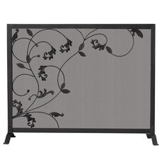 an iron fireplace screen with flowers and vines on the front, in black metal finish