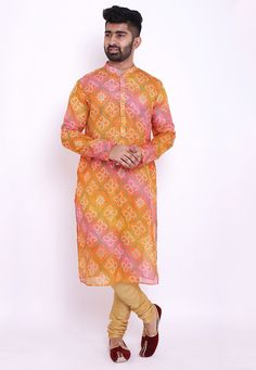 Readymade Art Kota Silk Kurta in Shaded Orange and Pink. This Collar Neck and Full Sleeve attire is Prettified with Buttons and Bandhej Print and has Two Side Pockets. Do note: Bottom and Footwear shown in the image is for presentation purposes only. Half to one inch may vary in measurement. (Slight variation in actual color vs. image is possible). We sell all kinds of menswear. Mens Kurta | Mens Kurta Pajama | Mens Sherwani | Mens Sherwani Sets | Traditional Menswear | Partywear Menswear | Indi Festive Multicolor Printed Kurta, Multicolor Ikat Print Sets With Long Sleeves, Multicolor Long Sleeve Sets With Ikat Print, Multicolor Bollywood Kurta For Transitional Season, Festive Multicolor Block Print Kurta, Fitted Orange Kurta For Transitional Seasons, Transitional Season Fitted Orange Kurta, Transitional Season Orange Fitted Kurta, Multicolor Block Print Kurta For Transitional Season