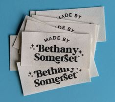 four white labels with black writing on them that say made by, behany somerset,