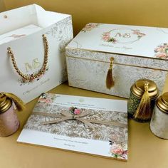 a table topped with boxes and jewelry on top of it