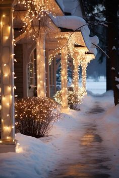 a house covered in snow with christmas lights