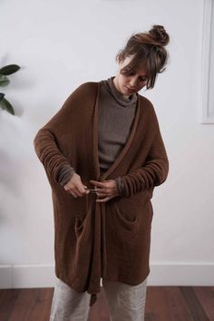 Dark Academia Coats & Jackets, Brown Merino Wool Long Sleeve Cardigan, Brown Soft Knit Cardigan For Work, Brown Knit Outerwear With Pockets, Wool Cardigan For Layering With Knit Fabrication, Wool Knit Cardigan For Layering, Brown Knitted Cardigan For Workwear, Cozy Brown Cardigan For Workwear, Cozy Brown Cardigan For Work