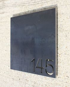 a metal plaque with the number forty five on it