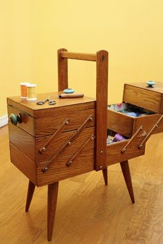 two wooden dressers with drawers on each side and one open drawer in the middle