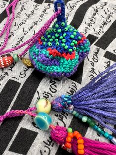 colorful beads and tassels on a black and white cloth