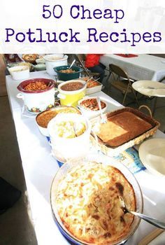 a table topped with lots of food on top of a white tablecloth covered table