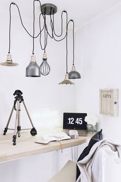 a desk with some lights hanging from it