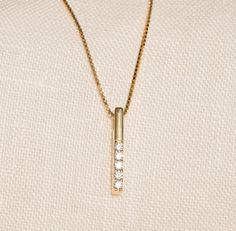 Our Solid Gold Diamond Vertical Bar Necklace is perfect for all the classic-lovers out there. With being gorgeous and elegant, it is an essential for your jewelry box. F E A T U R E S * Made to order. * Gold KT: 14K * Choice of Gold Color: Yellow Gold, Rose Gold, White Gold * Diamond Quality: Diamond carat: 0.02 ct. Clarity: VS2 Color: F-G Cut: Excellent cut Diamond type: Natural Setting Type: Prong Setting * Pendant Height: 15 mm / 0.59 inch * Pendant Width: 1 mm / 0.03 inch * Length: 14", 16", 18", 20" * Ready to Ship in 1-3 Business Days * 100% US sourced * 2-year warranty * Free Express International Shipping * Free returns within 14 days from the order date More * From * U s ▶ Want to find out more? Check out my shop https://www.etsy.com/shop/GelinDiamond ▶ Want to find out more about Elegant 14k Gold Bar Necklace For Anniversary, Minimalist 14k Gold Bar Necklace For Anniversary, Minimalist Yellow Gold Bar Necklace For Anniversary, Classic Yellow Gold Bar Necklace For Anniversary, 14k Gold Bar Necklace For Anniversary, Classic 14k Gold Bar Necklace For Formal Occasions, Classic Yellow Gold Bar Necklace For Formal Occasions, Elegant 14k Gold Rectangular Bar Necklace, Classic Everyday 14k Gold Bar Necklace