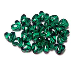 green heart shaped glass beads on a white background