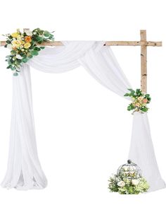 an arch decorated with flowers and greenery for a wedding ceremony on white background photo