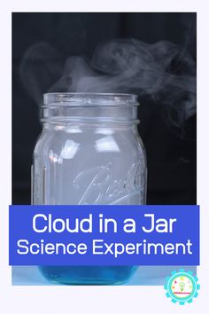 a jar filled with liquid sitting on top of a table next to a blue sign that says cloud in a jar science experiment