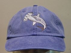 NEW EMBROIDERED HAMMERHEAD SHARK WILDLIFE BASEBALL HAT (HATS SHOWN ARE ROYAL BLUE, STONE, CARIBBEAN BLUE, FOREST GREEN, BLACK AND PERIWINKLE BLUE) Adams Optimum 6 Panel Baseball Hat Low Profile - 100% Cotton Twill Adult Cap Pigment Dyed - Garment Washed Hat 6 Panels with Sewn Matching Eyelet Visor with 3 Rows of Stitching Pre-formed Bill - Leather Strap with Brass Grommet Adjustable - One Size Fits Most An Extremely Comfortable Baseball Hat! Enjoy the Embroidered Hammerhead Shark Wildlife Hat! W Embroidery Apparel, Fire Clothes, Shark Hat, Ocean Gifts, How To Wash Hats, Cute Shark, Hammerhead Shark, Embroidery On Clothes, Embroidered Hats