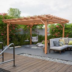 an outdoor living area with furniture and flowers