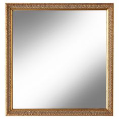 a gold framed mirror on a white background