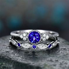 an engagement ring with blue sapphire and diamond accents