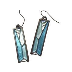 pair of earrings with blue and white stained glass in the shape of rectangles