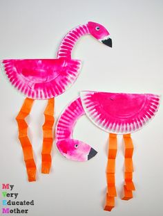 two pink flamingos made out of construction paper