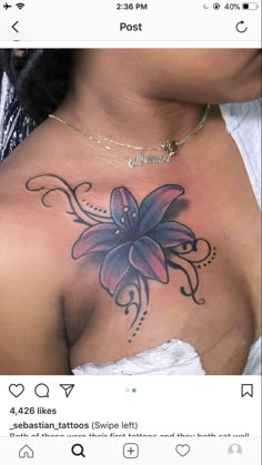 a woman's chest with a flower tattoo on it