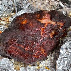 a piece of meat sitting on top of tin foil