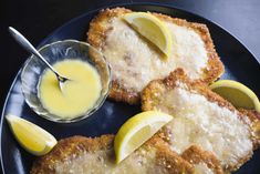 fried fish with lemon sauce on a plate