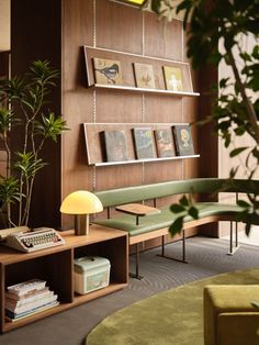 a living room filled with furniture and a book shelf next to a lamp on top of a table