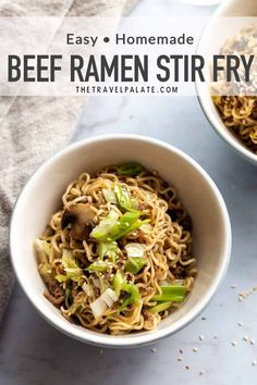 two bowls filled with noodles and vegetables on top of a white countertop next to a napkin