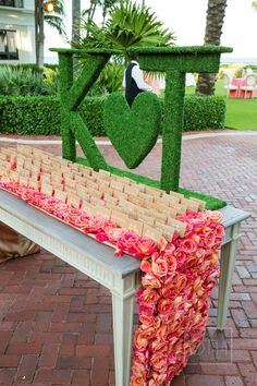 a bench decorated with flowers and letters