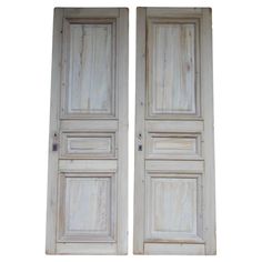 two white wooden doors with one open and the other closed on an isolated white background