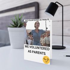 a card that says we volunteered as parents with a smiley face on the front