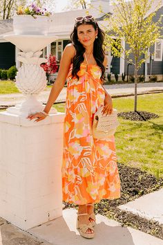 - Bring on some tropical vibes in this vibrant dress! - Lightweight, orange hued material with a colorful abstract floral design - Built in partial lining ending mid-thigh - A v-cut neckline with halter tie closure and adjustable spaghetti straps - Smocked detail on the upper back - Ruffled under-bust detail - Hidden side pockets - A relaxed silhouette that ends in a ruffled ankle length hemline Measurements S : Bust 30", Hip 38", Length 42", Waist 28". M : Bust 32", Hip 40", Length 42.5", Waist Abstract Floral Design, Island Adventure, Vibrant Dress, Leaves Print Dresses, Orange Leaf, Tropical Vibes, V Cut, Colorful Abstract, V Cuts