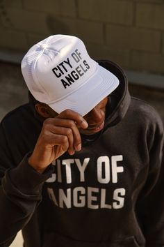 Our foam trucker hat is the perfect City of Angels staple. Vented mesh side panels allow for breathability + an interior sweatband makes it functional + comfortable even on the hottest days. Adjust the strap on the back to find your perfect fit. - High density puff print - Mesh details - Adjustable snap back closure Puff Print, City Of Angels, Outfits With Hats, Snap Back, Snap Backs, Hot Days, Side Panels, Panel Siding, Trucker Cap