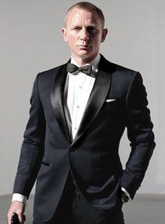 Surprise for 007 Fans! Create a dashing look for your next formal party by getting dressed up in our James Bond Skyfall Blue Tuxedo Suit. The wool suit offers a stunning look like James Bond from Skyfall with a contrasting effect, perfect for professional style and comfort. The popularly known James Bond Midnight Blue Tuxedo Suit is an ideal pick to adorn for occasions and events you are inclined to make an impression. 
 
 Rock the statement look with minimal effort by characterizing this James James Bond Tuxedo, James Bond Suit, Bond Suits, Suits Groom, Blazer Wedding, Suits Formal, Wedding Tux, Fashion Garments, Blue Wedding Inspiration