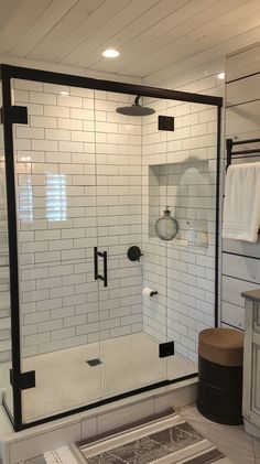 a walk in shower sitting inside of a bathroom