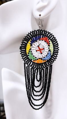 Product Material: Beads Product Color: Multi-Color Product Occasion: Everyday/Daily Handmade in kenya Handmade - No two pieces are identical - please expect small variations in the product received. Black Bohemian Beaded Earrings With Beaded Chain, Colorful Round Beaded Earrings, Multicolor Dangling Round Beads, Black Bohemian Beaded Chain Earrings, Adjustable Round Black Beaded Earrings, Multicolor Round Dangling Beads, Traditional Multicolor Beaded Earrings With Beaded Chain, Traditional Multicolor Beaded Chain Earrings, Multicolor Circular Beaded Jewelry