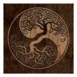 a wooden plaque with an image of a tree in the shape of a yin - yang