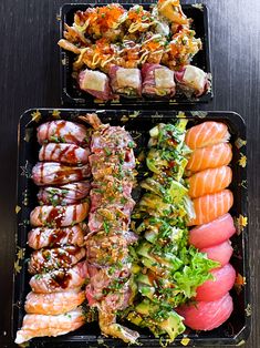 two trays filled with different types of sushi and sashimi on top of each other