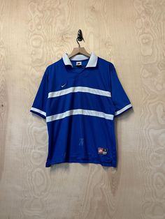 Medium 100% Polyester Pit to Pit 23" Back Collar to Bottom 26" Stains throughout (see pictures) Tee Shirt Nike Bleu, 90s Nike, Nike Blue, Short Sleeve Polo, Vintage 90s, White Stripe, Blue White, Polo Shirt, Blue And White