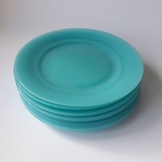 stack of blue plates sitting on top of each other