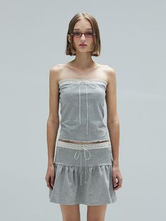 This is a trendy and unique top by DEARSTALKER that is made out of high quality and sturdy material. With distinctive mood of the design and young look, you can style it for your trendy and casual daily outfit.- Sturdy and elastic cotton blend fabric- Smoke banding on the back- Set up with matching skirt Heather Grey Stretch Tops For Spring, Gray Summer Tops For Day Out, Gray Fitted Tops For Day Out, Gray Fitted Top For Day Out, Fitted Heather Grey Top For Spring, Gray Cotton Tops For Spring, Gray Cotton Top For Spring, Casual Heather Grey Top For Spring, Gray Tops For Spring Day Out