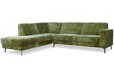 a green sectional couch sitting on top of a white floor