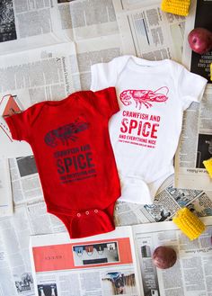 "**This is the original \"Louisiana Girls\" apparel. Copyright Kharis Creations, 2017.** If you're from the Pelican State, this adorable infant bodysuit is perfect for your little cajun! Comes in red or white, with a fun twist on an old favorite: \"Crawfish and Spice and everything nice--that's what Louisiana girls are made of!\" These bodysuits are 100% cotton and 100% Louisiana Local--designed and printed by small businesses in the greater Baton Rouge area. See the boy version here: https://ww Red Short Sleeve Cotton Bodysuit, Red Cotton Short Sleeve Bodysuit, Casual Red Cotton Bodysuit, Cute Red Short Sleeve Bodysuit, Red Fitted Casual Onesie, Red Cotton Onesie For Playwear, Red Fitted Cotton Bodysuit, Cute Red Cotton Onesie, American Apparel Bodysuit