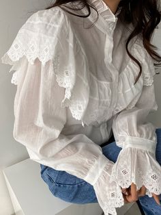 Uber stylish loose fit cotton embroidered blouse with button front, ruffle collar and cuff details. Model is in MINUSEY ONE SIZE. Please allow 5-12 days shipping when in restocking. * MINUSEY ONE SIZE = EU 34-38, US 2-6* 100% Cotton* Dry clean* Made in Korea - Model Height: 170cm/5'7" (US2, EU34) White Long Sleeve Blouse With Smocked Cuffs, White Top With Smocked Cuffs And Bishop Sleeves, White Cotton Blouse With Lace Cuffs, Casual White Blouse With Lace Cuffs, Collared Cotton Blouse With Broderie Anglaise, Cotton Blouse With Lace Cuffs, White Ruffled Button-up Blouse, White Blouse With Smocked Cuffs And Puff Sleeves, Feminine Cotton Blouse With Lace Cuffs