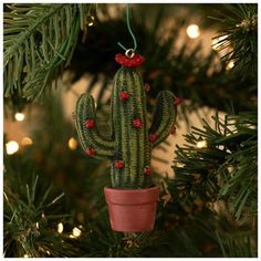 a cactus ornament hanging from a christmas tree