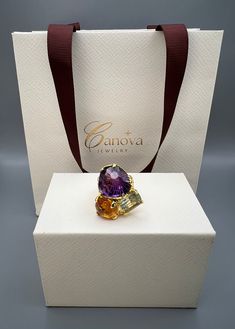 This beautiful handmade ring by Canova Jewelry is a perfect gift for any special occasion, whether it's for an engagement, wedding, anniversary, birthday or Valentine's Day. The ring features three natural gemstones, including a stunning purple amethyst as the main stone, along with citrine and green amethyst/prasiolite. The multicolor ring is made of 925 sterling silver and is designed with a cocktail style that showcases the beauty of nature and the luck and love that comes with it. The Ukraine-made ring is a unique piece of fine jewelry that is perfect for anyone who loves bohemian and magical themes. This piece is a true beauty that will surely captivate anyone's heart. Luxury Multi-stone Amethyst Wedding Ring, Luxury Multi-stone Amethyst Ring For Formal Occasions, Elegant Multi-stone Amethyst Ring Gift, Elegant Diamond Ring As Gift, Luxury Citrine Gemstones For Gifts, Luxury Rings With Stones, Luxury Crystal Ring With Gemstone Accents For Wedding, Luxury Multi-stone Amethyst Ring For Weddings, Elegant Yellow Gold Multi-stone Crystal Ring