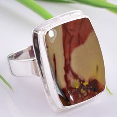 "MOOKAITE JASPER Ring, Handmade Mookaite Jewelry, Unique Bridesmaid Ring, Statement Ring, Engagement Ring, Gemstone Ring, Minimalist Ring Natural Mookaite Jasper Sterling Silver Ring, simple yet unique. Made of solid sterling silver. Perfect as a unique gift for a girlfriend or a special treat to yourself. ❥ Metal: Solid sterling silver ❥ US Ring Size: All Size Available ❥ Stone Cut: Cab ❥ Gemstone: Mookaite Jasper ❥ Gemstone Color: Yellow ❥ships worldwide from India ❥925 stamped ❥Handmade item About Mookaite Jasper Mookaite stone is very grounding. It helps to ground your mind, heart, soul and spirit into this earthly realm. It is also said to bring us back to the present, giving the feeling of being in the \"now\", which in turn helps us make clearer decisions based on what's going on ar Engagement Ring Gemstone, Bridesmaid Ring, Yellow Jasper, Bridesmaid Rings, Friendship Day Gifts, Unique Bridesmaid, Jasper Ring, Mookaite Jasper, Ring Simple