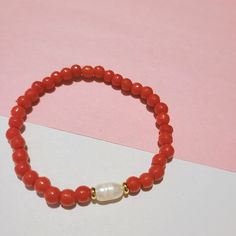 Adjustable Coral Stretch Bracelet, Adjustable Coral Bracelets As A Gift, Adjustable Coral Stretch Bracelet As Gift, Coral Bangle Bracelet As Gift, Coral Stretch Bracelet With Round Beads, Coral Stretch Bracelet With Round Beads As Gift, Orange Stackable Beaded Bracelets As Gift, Orange Stackable Beaded Bracelets For Gifts, Holiday Bracelets