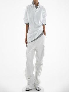 Chic and trendy oversized wide leg cargo pants in 100% cotton. Three pockets down outside leg with snap button closure detail. Model is in MINUSEY S. ✔️ Free worldwide express shipping over $100✔️ Loved by 6,500+ customers✔️ Limited edition collections, maximum styleStay ahead of the trend with can’t-find-anywhere-else staples. Your closet will thank you 💕 * MINUSEY S = EU 34, US 2* MINUSEY M = EU 36, US 4* 100% Cotton* Dry clean* Made in Korea - Model Height: 169cm/5'6" (US2, EU34) White Summer Cargo Pants With Multiple Pockets, White Cargo Jeans With Multiple Pockets For Summer, White Cargo Style Parachute Pants For Summer, White Parachute Pants With Side Pockets For Work, Baggy White Cargo Jeans For Summer, Trendy White Cargo Pants With Multiple Pockets, White Wide Leg Cargo Pants For Streetwear, White Cargo Style Parachute Pants For Spring, Streetwear Wide Leg White Cargo Pants