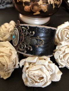 "🔸🔸orders are delayed by a few days this week. Thank you for your patience Country leather bracelet cuff, western jewelry New genuine black distressed tooled leather 1 1/2\" strap has been adorned with an oval southwestern silver concho which sets on a copper square filigree and an antiqued silver filigree which has been given a black patina. It is attached to the leather with two textured gunmetal rivets. One antiqued silver snap has been placed to fit up to a 6 1/2\" wrist. I can add another Western Concho Bracelets For Festival, Western Style Concho Bracelets For Festivals, Adjustable Western Cuff Bracelet For Festivals, Adjustable Hand Tooled Western Leather Bracelet, Adjustable Western Style Cuff Bracelet For Festivals, Adjustable Western Style Festival Cuff Bracelet, Western Style Adjustable Cuff Bracelet For Festivals, Adjustable Concho Cuff Bracelet For Festival, Rustic Concho Cuff Bracelet For Festival